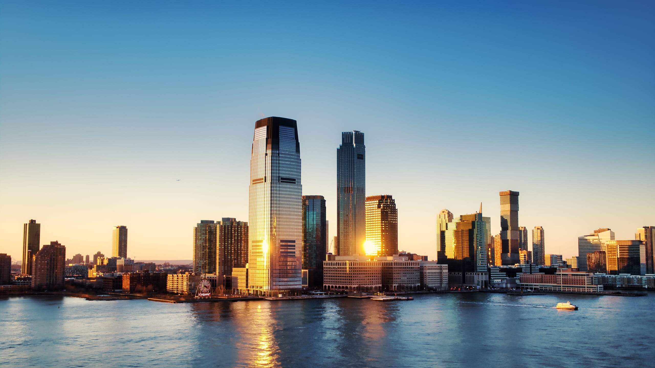 Jersey City waterfront skyline at golden hour representing family wealth and legacy